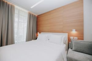Voodi või voodid majutusasutuse Magnus Hotel toas