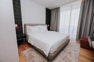 Voodi või voodid majutusasutuse Magnus Hotel toas