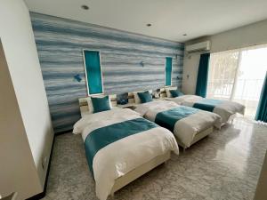 Postel nebo postele na pokoji v ubytování Sunrise Terrace Kin Town - Vacation STAY 16667v