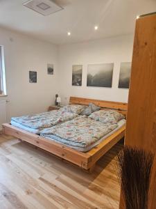 a bedroom with a large bed in a room at Ferienwohnung Wein in Holzheim am Forst