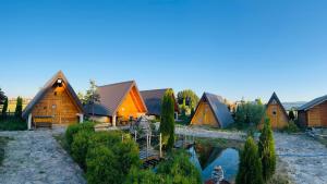 a group of wooden cabins at a resort at Smaka Brvnare in Sjenica