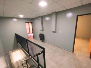 an empty room with a staircase in a building at CTA DIVISION House in Malargüe
