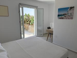 Postel nebo postele na pokoji v ubytování Psaros Village + 37 fotografií