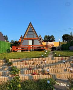a house with stairs in front of it at Villa Roi in Ferizaj
