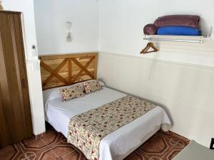 a small bedroom with a small bed in a room at La Carlota in Gualeguaychú +12 photos
