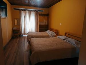 เตียงในห้องที่ Hotel y restaurante casa vieja plaza ipiales