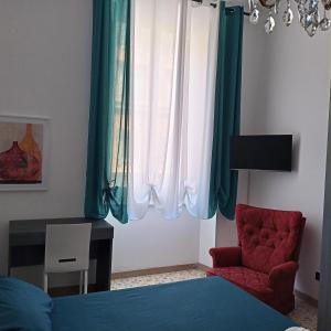a bedroom with a bed and a chair and a desk at Mura di prati in Rome