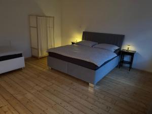 Postel nebo postele na pokoji v ubytování Apartmány Kanteho grunt