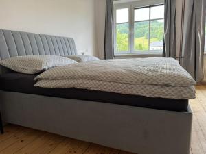 Postel nebo postele na pokoji v ubytování Apartmány Kanteho grunt