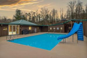 a swimming pool with a slide and a playground at Black Bear Splash By Avada Properties in Sevierville