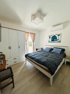 a bedroom with a large bed and a window at Villa V in Svetvinčenat +26 photos