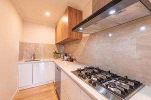 a kitchen with a stove and a counter top at Supernova B -2 Bedrooms in Lake Tekapo