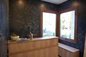 a window in a room with a counter and a window sill at Guti Andino Boutique in San Carlos de Bariloche +44 photos