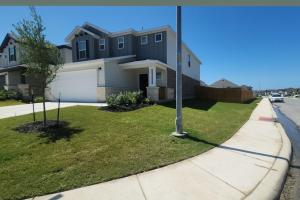 a house on the side of a street at Private Cozy Room and Bathroom in Home near Seaworld Riverwalk and AFB in San Antonio