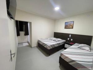 Postel nebo postele na pokoji v ubytování Hotel Belenzinho