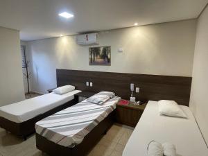 Postel nebo postele na pokoji v ubytování Hotel Belenzinho