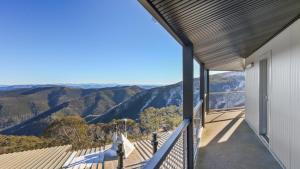 a balcony with a view of the mountains at Alpine Heights 18 in Mount Hotham