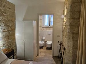 a bathroom with a white cabinet and a sink at Casa Petra Bari in Bari +46 photos