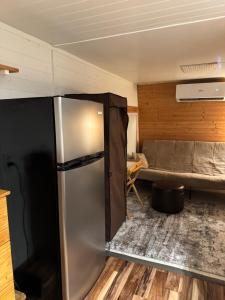a kitchen with a refrigerator in a room at Cottage in Punta Gorda in Punta Gorda