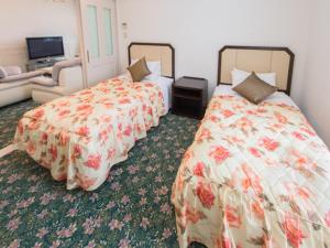 Postel nebo postele na pokoji v ubytování Spa Resort LiVEMAX