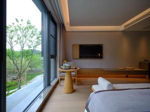 Ruolinqiao Valley Garden Hotel客房内的一张或多张床位