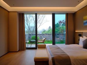 Ruolinqiao Valley Garden Hotel客房内的一张或多张床位