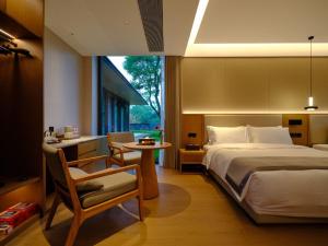 Ruolinqiao Valley Garden Hotel客房内的一张或多张床位
