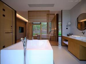 Ruolinqiao Valley Garden Hotel客房内的一张或多张床位