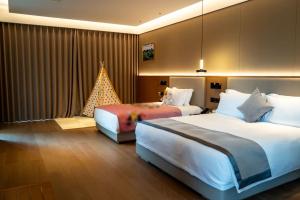 Ruolinqiao Valley Garden Hotel客房内的一张或多张床位