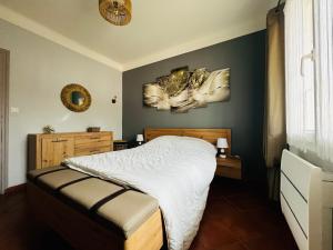 a bedroom with a bed and a mirror on the wall at Maison à Argelès Plage, 50m de la Mer, WIFI, Clim, Terrasse, Parking Privé - FR-1-309-322 in Argelès-sur-Mer
