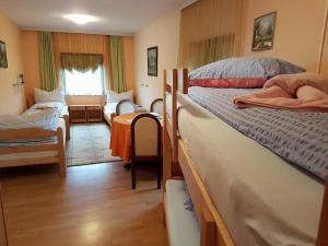 Postel nebo postele na pokoji v ubytování Guest House Rose