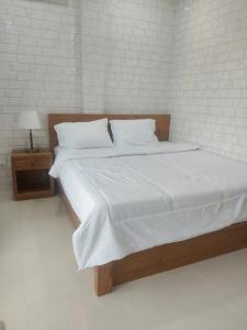 Postel nebo postele na pokoji v ubytování Rumah Candri