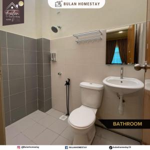 a bathroom with a toilet and a sink at BULAN Homestay Melaka in Melaka
