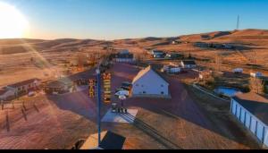 an aerial view of a small white building in a field at Lake Stop Resort in Buffalo