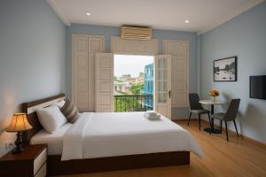 Postel nebo postele na pokoji v ubytování Eco Nest Hotel Đình Ngang