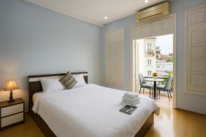 Postel nebo postele na pokoji v ubytování Eco Nest Hotel Đình Ngang