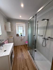 a bathroom with a shower and a sink at El Ansar de Daniela , Casa Rural in Treceño +63 photos