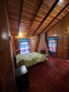 Ένα ή περισσότερα κρεβάτια σε δωμάτιο στο Cabañas San José del Pacífico