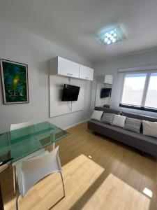 Μια τηλεόραση ή/και κέντρο ψυχαγωγίας στο Hotel Ninet Al Lorena Paulista Jardins com garagem cozinha 3107