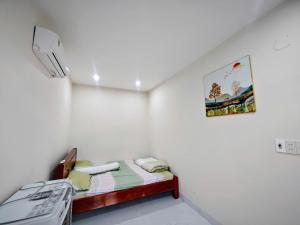 Postel nebo postele na pokoji v ubytování Mani House