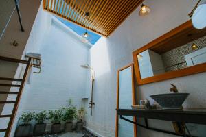 a bathroom with a sink and a mirror at Perolas Villas Resort - Ke Ga Bay in Phan Thiet +143 photos