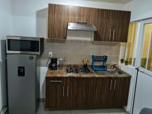 Η κουζίνα ή μικρή κουζίνα στο Tu espacio cómodo en Villas del Refugio