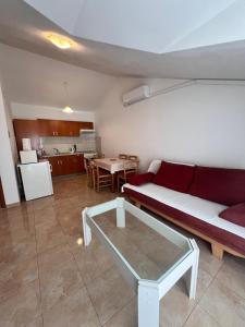 a living room with a couch and a table at Apartment Danijela in Vodice