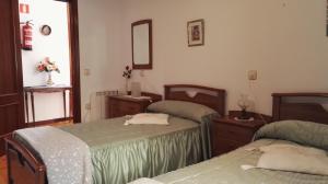 Giường trong phòng chung tại La Casina de Llanes