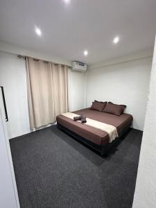 a bedroom with a large bed in a room at 3-Bedroom family-ready flat in Namadi Heights in Suva