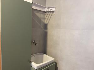 a bathroom with a sink and a toilet in it at Casa Mar III in João Pessoa +10 photos