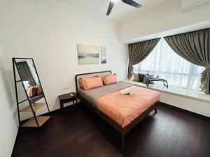 Ένα ή περισσότερα κρεβάτια σε δωμάτιο στο Emerald Homes at R&F - free WiFi & 1 carpark - Dual-Key