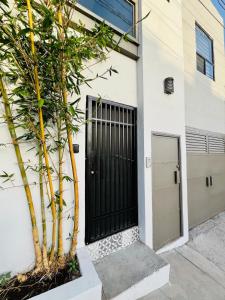 a black door on the side of a building at Loft apartment in the north area in Chihuahua
