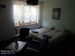 Postel nebo postele na pokoji v ubytování Dom Kącik