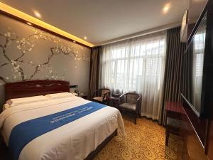 TV a/nebo společenská místnost v ubytování Lanzhou Hualian Hotel